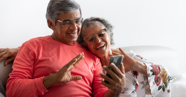 senior couple looking at a smartphone